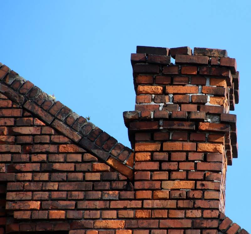 Damaged chimney on an Hanover Park home showing cracks and missing mortar